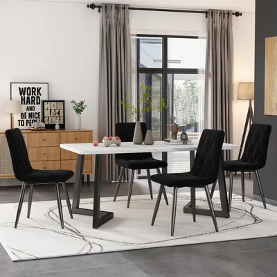 A dining room setting with a table and chairs.