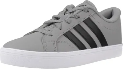 A single gray Adidas sneaker with black stripes is shown from a side-angle on a white background.
