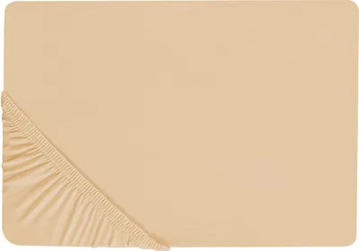 A close-up view of a beige fitted sheet, showing the elasticized corner.