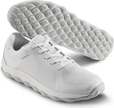 A pair of white Sika sneakers shown from a slightly elevated angle, with one shoe in the foreground and the sole of another shoe visible behind it.
