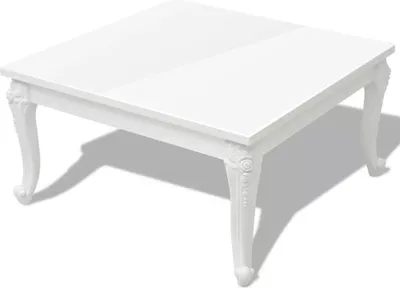 A white square coffee table with ornate legs is shown from a slightly elevated angle.