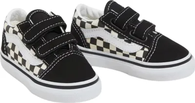 A pair of children's Vans Old Skool V sneakers with a checkerboard pattern.