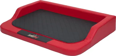 A red and black dog bed with a quilted black cushion.