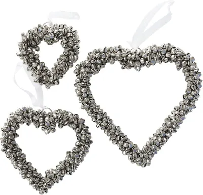 Three silver heart-shaped ornaments made of small bells, hanging from white ribbons.