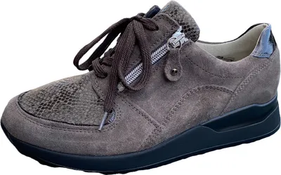 A single brown sneaker is shown against a white background.