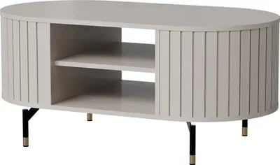 A light gray oval coffee table with two shelves and fluted sides, supported by black legs with gold accents.