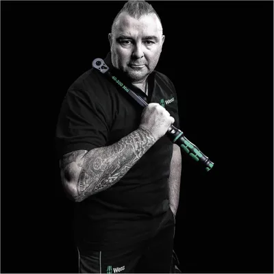 A man holding a torque wrench.