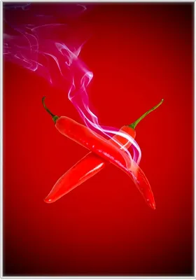Produktbild von Wallario Wandbild Rauchende Chili-Schoten im Duo vor rotem Hintergrund, Größe: 70,30 x 100,30 cm, Poster mit weißem Kunststoffrahmen