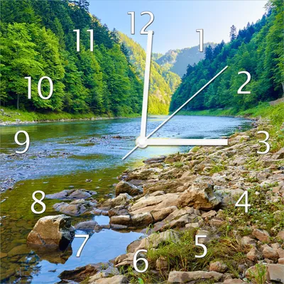 Produktbild von Wallario Design Wanduhr Fluss in den Bergen an steinigem Ufer aus Echtglas, Größe 30 x 30 cm