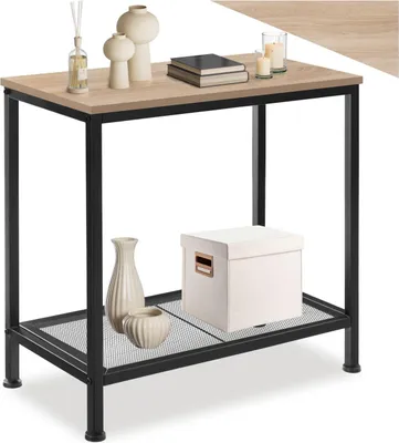 A narrow table with a wood-look top and black metal legs, decorated with vases, books, candles, and a storage box.