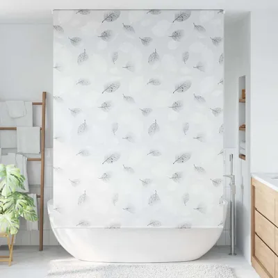 A bathroom scene with a shower curtain and bathtub.