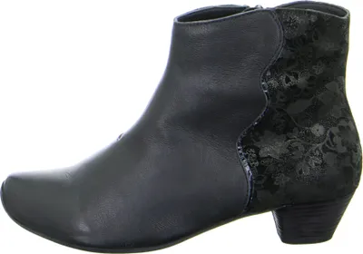 A side view of a black ankle boot with a floral pattern on the heel.