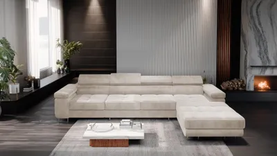 A modern living room with a large sectional sofa, coffee table, and fireplace.