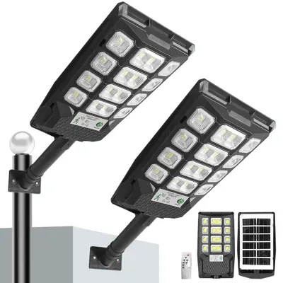Immagine prodotto di Lampade solari - Lampade da giardino a LED - Set da 2 - Sensore di movimento - Resistenti all'acqua (IP65) - Telecomando - Per uso esterno
