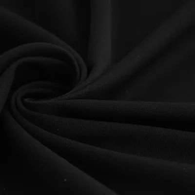 Imagen del producto de Tela elástica de gabardina negra, 150 cm, con certificación