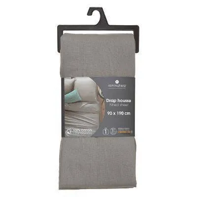 A grey fitted sheet is folded and displayed on a hanger, with a product label attached.
