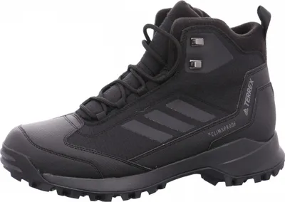 A black Adidas Terrex hiking boot is shown against a white background.