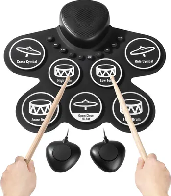 Produktbild von Elektronisches Schlagzeug - Aufrollbares E-Drum-Set - Mit 7 Pads - Lautsprecher - Kopfhöreranschluss & MIDI - Mit 2 Fußpedalen & Drumsticks - Für Kinder ab 3 Jahren - Schwarz