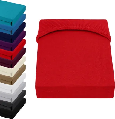 A stack of colorful fitted sheets is shown on the left, and a single red fitted sheet is displayed prominently on the right.