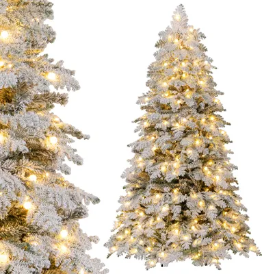 Two flocked Christmas trees with warm white lights are shown against a white background. One tree is in the foreground on the left, and the other is in the midground on the right.