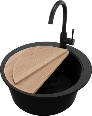 A black round kitchen sink with a wooden cutting board and a black faucet.