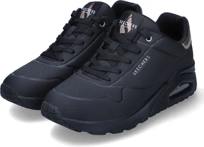 A pair of black Skechers Uno sneakers.