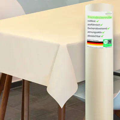 A roll of cream-colored tablecloth is shown next to a table covered with the same material.