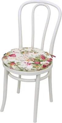 A white chair with a floral cushion.