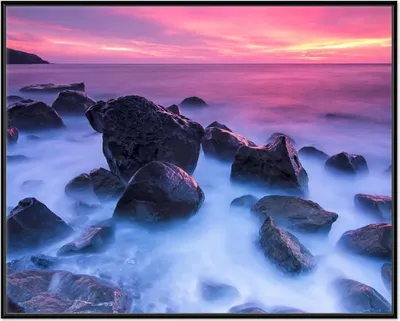 Produktbild von Wallario Wandbild Felsen im Meer bei Sonnenuntergang, Größe: 40,30 x 50,30 cm, Poster mit schwarzem Aluminiumrahmen
