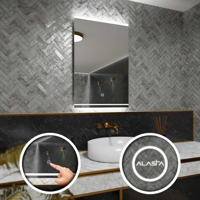 A modern bathroom vanity with a mirror, sink, and faucet, showcasing a touch-sensitive light switch on the mirror.