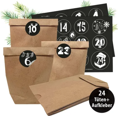 A collection of brown paper bags with Christmas-themed stickers, arranged for an advent calendar.