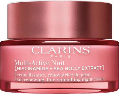 A close-up product shot of a Clarins night cream jar.