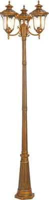 A three-armed outdoor lamp post with a vintage, antique look.