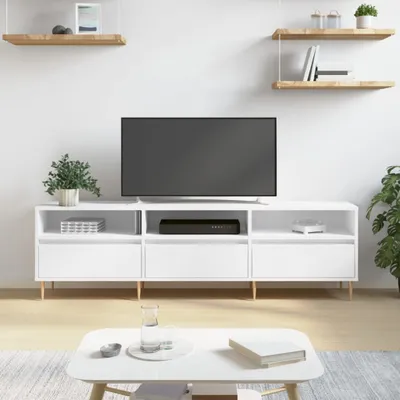 A white TV stand with a television on top, placed in a minimalist room setting.