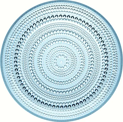 A clear, top-down view of a light blue glass plate with a circular, concentric pattern of small, raised bubbles.