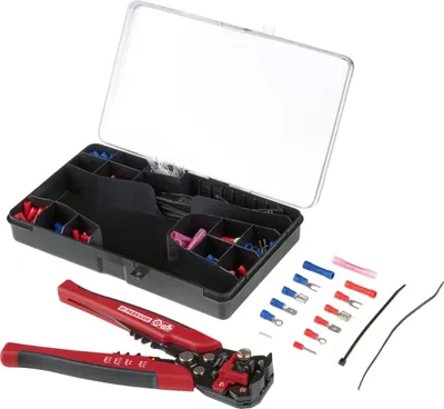 A tool kit with various electrical connectors and a crimping tool, laid out on a white background.