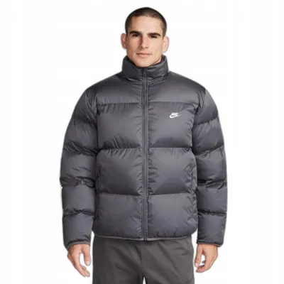 A man wearing a gray Nike puffer jacket.