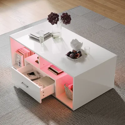 A modern white coffee table with integrated RGB LED lighting, placed on a patterned rug in a living room setting.
