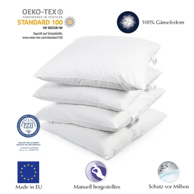 A stack of four white pillows on a white background, with various certification logos and text overlays.
