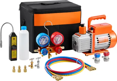 A set of AC vacuum pump and manifold gauge tools is displayed on a white background.