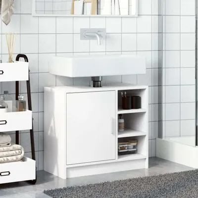 A white bathroom vanity cabinet with a sink above it, set against a tiled wall.