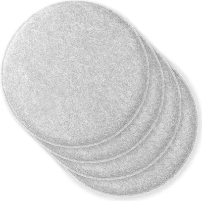 A stack of four round, light gray felt seat cushions on a white background.