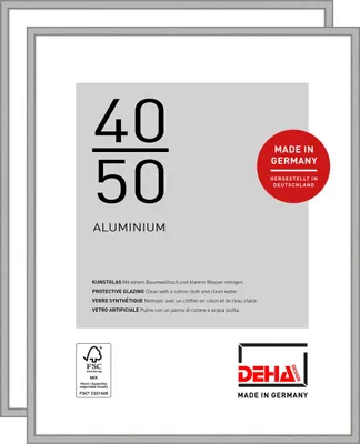 A product shot of two silver picture frames stacked on top of each other, with informational text and logos on the front of the top frame.
