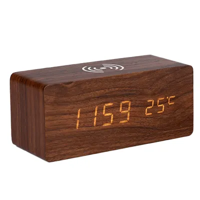 A digital alarm clock with a wooden casing and LED display.