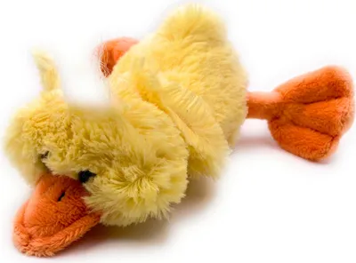 A plush toy duckling lying on its side against a white background.