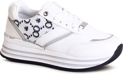 A studio shot of a single white platform sneaker.