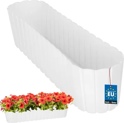 A white oval planter box is shown, with a smaller planter box filled with red flowers in the foreground.