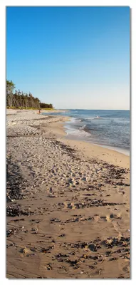 Produktbild von Wallario selbstklebende Türtapete 93 x 205 cm mit Schutzlaminat - Einsamer Strand am Meer - Blauer Himmel