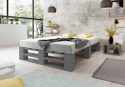 A bedroom scene featuring a pallet bed.