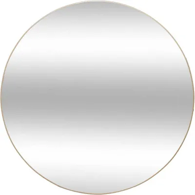 A round mirror with a thin gold frame.